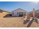 Large backyard with gravel, patio, and seating area at 12246 E Pivot Peak E --, Gold Canyon, AZ 85118