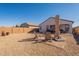 Spacious backyard with gravel, patio, and seating area at 12246 E Pivot Peak E --, Gold Canyon, AZ 85118