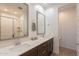 Modern bathroom with double vanity, quartz countertop, and large walk-in shower at 12246 E Pivot Peak E --, Gold Canyon, AZ 85118