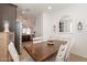 Bright dining room with a view into the kitchen area at 12246 E Pivot Peak E --, Gold Canyon, AZ 85118