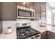 Stainless steel range and microwave in modern kitchen at 12246 E Pivot Peak E --, Gold Canyon, AZ 85118