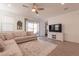 Spacious living room with L-shaped sofa and sliding glass door at 12246 E Pivot Peak E --, Gold Canyon, AZ 85118