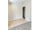 Simple dining area with tile floor and carpet at 12367 W Woodland Ave, Avondale, AZ 85323