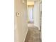 Clean hallway with carpeted flooring and neutral-toned walls at 12367 W Woodland Ave, Avondale, AZ 85323