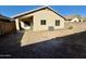 Back exterior view of house showing patio and yard at 12367 W Woodland Ave, Avondale, AZ 85323