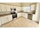 Bright kitchen with stainless steel appliances and white cabinets at 12367 W Woodland Ave, Avondale, AZ 85323