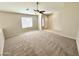 Bright living room with entryway and large window at 12367 W Woodland Ave, Avondale, AZ 85323