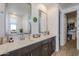 Double vanity bathroom with large mirrors and walk-in closet at 12474 E Soloman Rd, Gold Canyon, AZ 85118