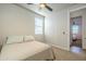 Bedroom with ceiling fan and view into another room at 12474 E Soloman Rd, Gold Canyon, AZ 85118