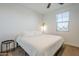 Spacious bedroom with a side table and window at 12474 E Soloman Rd, Gold Canyon, AZ 85118