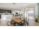 Kitchen and dining area with an island and patio access at 12474 E Soloman Rd, Gold Canyon, AZ 85118