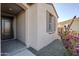 Front entrance with dark brown door and purple flowering bush at 12474 E Soloman Rd, Gold Canyon, AZ 85118