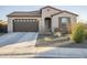 One-story house with brown garage door and neutral exterior at 12474 E Soloman Rd, Gold Canyon, AZ 85118