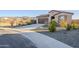 Modern single story home with mountain views and gravel driveway at 12474 E Soloman Rd, Gold Canyon, AZ 85118