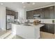 Modern kitchen with island, stainless steel appliances, and white countertops at 12474 E Soloman Rd, Gold Canyon, AZ 85118