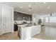 Modern kitchen with island, stainless steel appliances, and white countertops at 12474 E Soloman Rd, Gold Canyon, AZ 85118