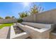 Modern backyard water feature with stone and sleek design at 12808 N 144Th Dr, Surprise, AZ 85379