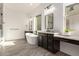 Elegant bathroom with soaking tub, double vanity, and walk-in shower at 12808 N 144Th Dr, Surprise, AZ 85379