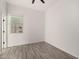 Simple bedroom with wood flooring and a window at 12808 N 144Th Dr, Surprise, AZ 85379