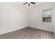 Spacious bedroom featuring wood-look tile floors and a window with natural light at 12808 N 144Th Dr, Surprise, AZ 85379