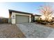 Modern home with a two-car garage and well-maintained landscaping at 12808 N 144Th Dr, Surprise, AZ 85379