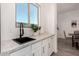 Small kitchen nook with sink and white cabinets at 12808 N 144Th Dr, Surprise, AZ 85379