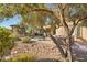 Landscaped backyard oasis with hot tub, pergola, and mature trees at 12975 W Andrew Ln, Peoria, AZ 85383