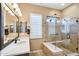 Modern bathroom with a large glass shower, double vanity, and stylish tile work at 12975 W Andrew Ln, Peoria, AZ 85383