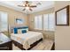 Spacious bedroom with a king-size bed and plenty of natural light at 12975 W Andrew Ln, Peoria, AZ 85383