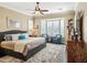 Main bedroom with a king-size bed, bay window, and plenty of closet space at 12975 W Andrew Ln, Peoria, AZ 85383