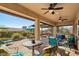 Relaxing covered patio perfect for outdoor dining and lounging at 12975 W Andrew Ln, Peoria, AZ 85383