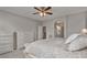 Spacious bedroom featuring neutral walls, ceiling fan, and ensuite bathroom access at 1364 E Elysian Pass, Queen Creek, AZ 85140