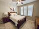 Cozy bedroom with natural light, a comfortable bed, and plantation shutters at 1364 E Elysian Pass, Queen Creek, AZ 85140