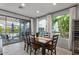 Dining area with table, six chairs, and sliding doors leading to the patio at 1364 E Elysian Pass, Queen Creek, AZ 85140