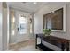 Inviting home foyer with decorative glass door, a console table, and neutral walls at 1364 E Elysian Pass, Queen Creek, AZ 85140