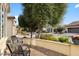 Charming front porch with brick pavers, seating, and landscaped front yard at 1364 E Elysian Pass, Queen Creek, AZ 85140