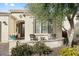 Charming front porch featuring an inviting seating area and lush landscaping at 1364 E Elysian Pass, Queen Creek, AZ 85140