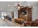 Cozy living room featuring built-in shelving, ceiling fan, and comfortable seating at 1364 E Elysian Pass, Queen Creek, AZ 85140