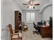 Home office with built-in desk, shelving, and plantation shutters, ideal for remote work at 1364 E Elysian Pass, Queen Creek, AZ 85140