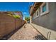 Gravel backyard with a block wall and small plants at 13713 W Harvest Ave, Litchfield Park, AZ 85340