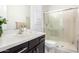 Bathroom with walk-in shower and modern vanity at 13713 W Harvest Ave, Litchfield Park, AZ 85340