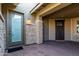 Front entrance with stone and wood accents at 13713 W Harvest Ave, Litchfield Park, AZ 85340