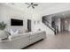 Living room boasts a gray sectional sofa and a stone accent wall at 13713 W Harvest Ave, Litchfield Park, AZ 85340