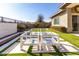 Backyard patio with modern seating and fire pit at 13713 W Harvest Ave, Litchfield Park, AZ 85340