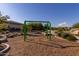 Green swing set in playground at 13713 W Harvest Ave, Litchfield Park, AZ 85340