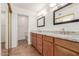 Double vanity bathroom with granite countertops and tile flooring at 14413 N 91St St, Scottsdale, AZ 85260