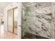 Modern bathroom with marble shower and glass enclosure at 14413 N 91St St, Scottsdale, AZ 85260