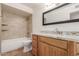 Updated bathroom with granite countertops and tile flooring at 14413 N 91St St, Scottsdale, AZ 85260