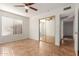 Well-lit bedroom with mirrored closet doors at 14413 N 91St St, Scottsdale, AZ 85260