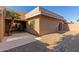 Tan stucco exterior with private patio and landscaping at 14413 N 91St St, Scottsdale, AZ 85260